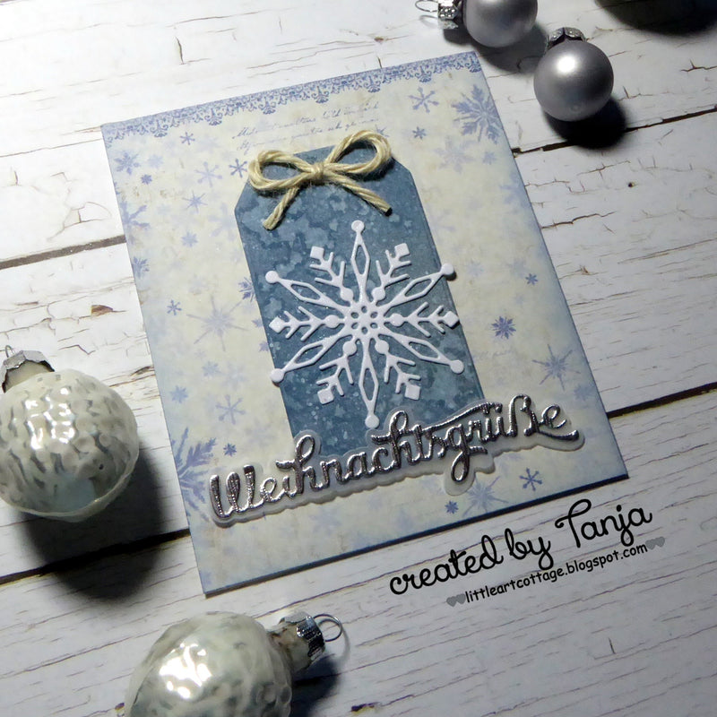 Weihnachtsgrüße und eine Schneeflocke