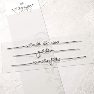 Clear Stamp Set mit den handschriftlichen Schriftzügen „wünsch dir was“, „gutschein“ und „wunscherfüller“ auf transparenter Trägerfolie, ca. 13 cm breit.